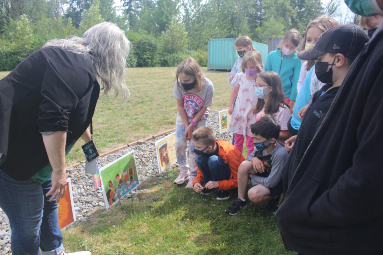 RIDGEFIELD: The class read the story with South Ridge Elementary School librarian Emily Crawford by following the pages posted along the path.