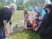 RIDGEFIELD: The class read the story with South Ridge Elementary School librarian Emily Crawford by following the pages posted along the path.