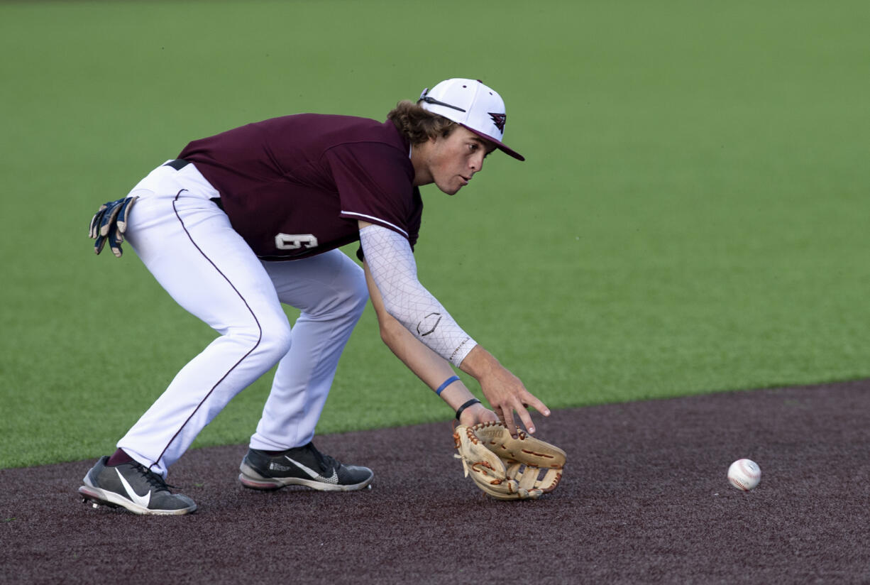 Ridgefield’s John Peck fields a groundball in a West Coast League baseball game on Tuesday, June 22, 2021, at the Ridgefield Outdoor Recreation Complex. Yakima Valley won 10-1 to give the Raptors their first home loss.