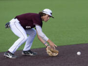 Ridgefield’s John Peck fields a groundball in a West Coast League baseball game on Tuesday, June 22, 2021, at the Ridgefield Outdoor Recreation Complex. Yakima Valley won 10-1 to give the Raptors their first home loss.