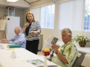 Vancouver Mayor Anne McEnerny-Ogle, center, responds to comments from her challengers, Earl Bowerman, left, and Doug Coop, right, at a candidates forum in June.