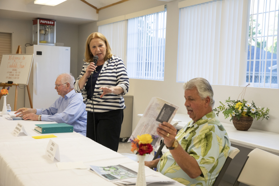 Vancouver Mayor Anne McEnerny-Ogle, center, responds to comments from her challengers, Earl Bowerman, left, and Doug Coop, right, at a candidates forum in June.