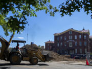 Construction has begun on the Aegis Phase 1 six-story apartment complex near the Providence Academy. Workers plan to construct a tower crane today.