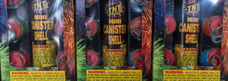 Boxes of "Mini Canister Shell" fireworks sit on shelves inside TNT Fireworks Warehouse.