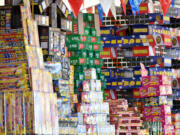 Stacks of fireworks sit atop shelves Thursday at the TNT Fireworks Warehouse in Hazel Dell. Clark County banned the use and sale of fireworks effective Tuesday.