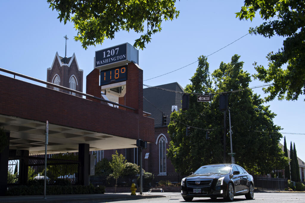 A sign in downtown Vancouver reflects 118 degrees around 4 p.m. on Monday afternoon, June 28, 2021.