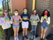 RIDGEFIELD: A group of fourth-grade students displays their decorated rocks.