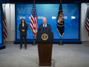 Vice President Kamala Harris listens as President Joe Biden speaks about the COVID-19 vaccination program, in the South Court Auditorium on the White House campus, Wednesday, June 2, 2021, in Washington.