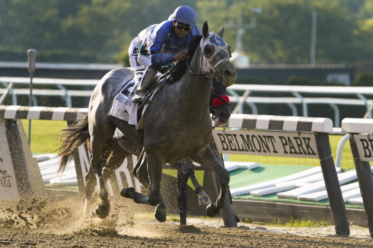 Essential Quality (2), with jockey Luis Saez up, crosses the finish line to win the 153rd running of the Belmont Stakes horse race, Saturday, June 5, 2021, At Belmont Park in Elmont, N.Y.