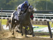 Essential Quality (2), with jockey Luis Saez up, crosses the finish line to win the 153rd running of the Belmont Stakes horse race, Saturday, June 5, 2021, At Belmont Park in Elmont, N.Y.