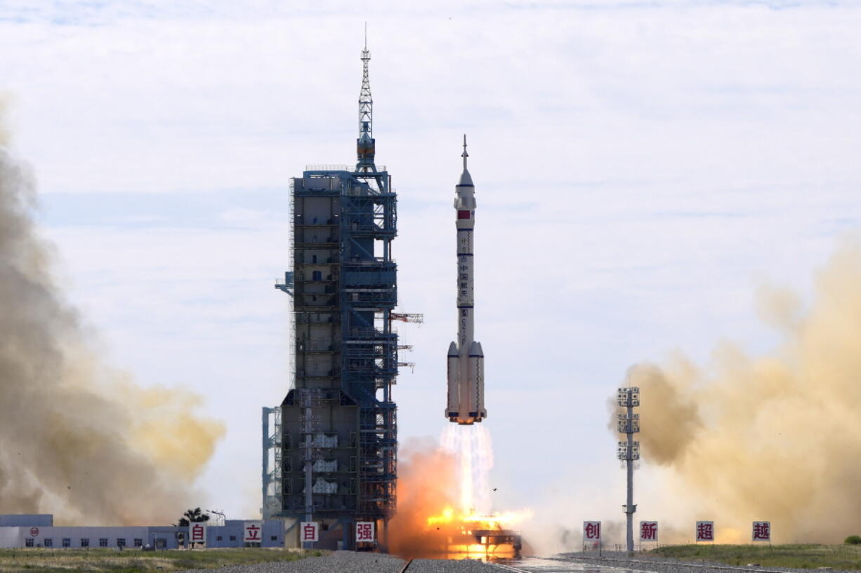 A Long March-2F Y12 rocket carrying a crew of Chinese astronauts in a Shenzhou-12 spaceship lifts off at the Jiuquan Satellite Launch Center in Jiuquan in northwestern China, Thursday, June 17, 2021. China has launched the first three-man crew to its new space station in its the ambitious programs first crewed mission in five years.