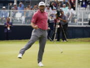 Jon Rahm reacts to making his birdie putt on the 18th green during the final round of the U.S. Open Golf Championship, Sunday in San Diego.