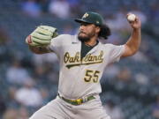 Oakland Athletics starting pitcher Sean Manaea throws to a Seattle Mariners batter during the fifth inning of a baseball game Wednesday, June 2, 2021, in Seattle. (AP Photo/Ted S.