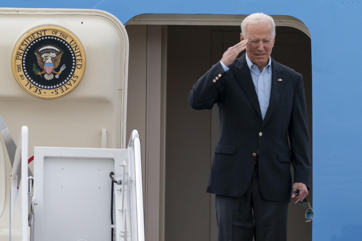 President Joe Biden salutes as he boards Air Force One upon departure, Wednesday, June 9, 2021, at Andrews Air Force Base, Md. Biden is embarking on the first overseas trip of his term, and is eager to reassert the United States on the world stage, steadying European allies deeply shaken by his predecessor and pushing democracy as the only bulwark to the rising forces of authoritarianism.