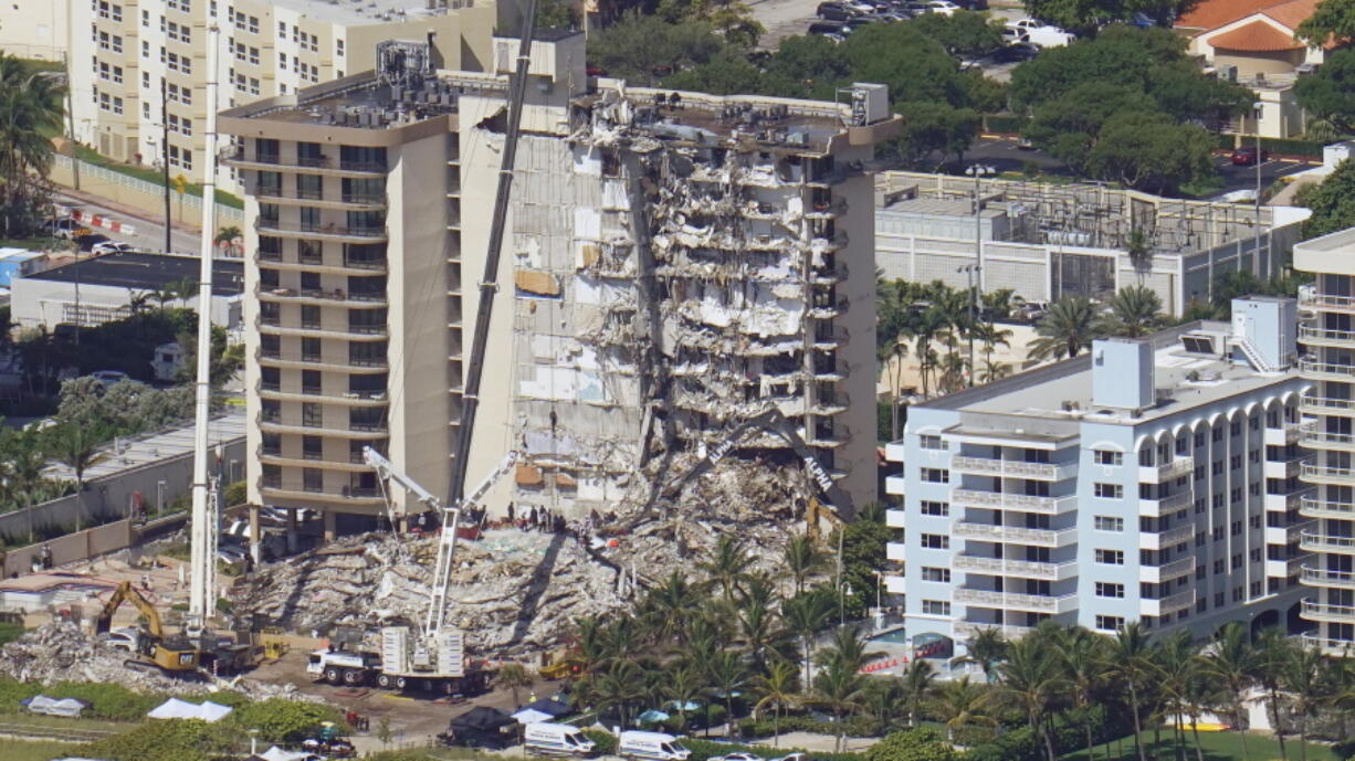 Crews work in the rubble at the Champlain Towers South Condo, Sunday, June 27, 2021, in Surfside, Fla. One hundred fifty-nine people were still unaccounted for two days after Thursday's collapse.