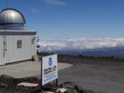 The Mauna Loa Atmospheric Baseline Observatory, atop Hawaii's largest mountain in order to sample air free of local pollution. Heat-trapping carbon dioxide levels in the air peaked in May 2021, scientists reported Monday.