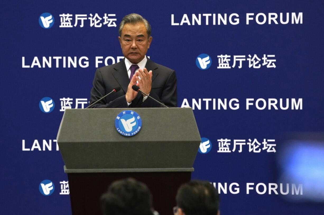 Chinese Foreign Minister Wang Yi attends a symposium to mark the 50th anniversary of the People's Republic of China's entry into the U.N. at the Foreign Ministry in Beijing on Friday, June 25, 2021. Foreign Minister Wang Yi said China remains deeply committed to United Nations peacekeeping efforts, where more than 2,400 Chinese troops and police are serving, a contribution that underscores China's increasing prominence in the world body.