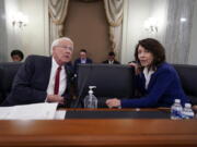 Sen. Roger Wicker, R-Miss., left, and Sen. Maria Cantwell, D-Wash., chair of the Senate Commerce, Science, and Transportation Committee, prepare to hold a hearing on student athlete compensation and federal legislative proposals to enable athletes participating in collegiate sports to monetize their name, image, and likeness, at the Capitol in Washington, Wednesday, June 9, 2021. (AP Photo/J.