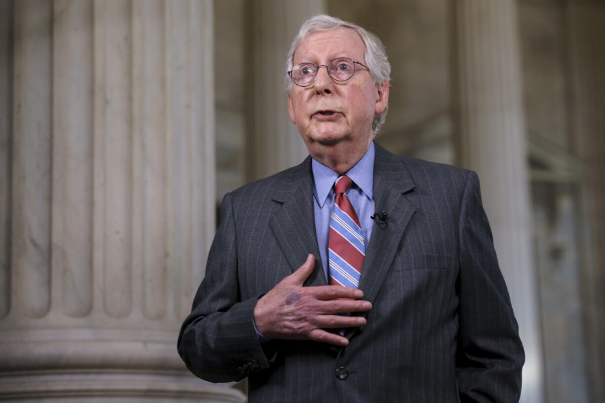 Senate Minority Leader Mitch McConnell, R-Ky., does a cable news interview before the start of a two-week recess, at the Capitol in Washington, Wednesday, June 23, 2021. Earlier, President Joe Biden announced a bipartisan agreement on a pared-down infrastructure plan that would make a start on his top legislative priority and validate his efforts to reach across the political aisle. (AP Photo/J.