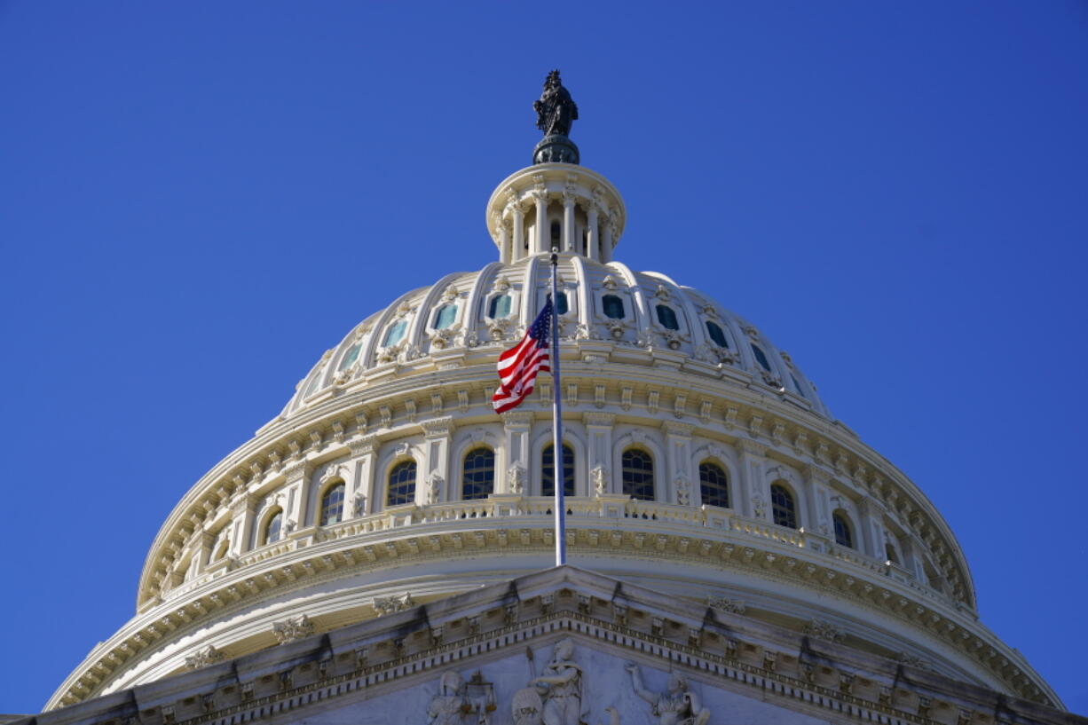 FILE - In this Tuesday, Dec. 29, 2020, file photo, is the U.S. Capitol in Washington. Congress on Thursday, June 24, 2021, overturned a set of regulations enacted in the final days of the Trump administration that effectively allowed payday lenders to avoid state laws capping interest rates. The House voted 218-208 to overturn the Office of the Comptroller of the Currency's payday lending regulations, with one Republican voting with Democrats.