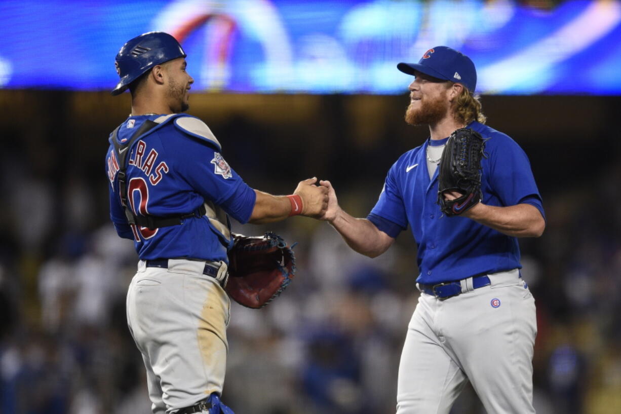 Chicago Cubs relief pitcher Craig Kimbrel, right, celebrates with catcher Willson Contreras after the final out for a combined no-hitter after a baseball game against the Los Angeles Dodgers in Los Angeles, Thursday, June 24, 2021. The Cubs won 4-0.