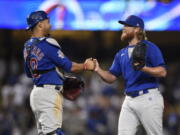 Chicago Cubs relief pitcher Craig Kimbrel, right, celebrates with catcher Willson Contreras after the final out for a combined no-hitter after a baseball game against the Los Angeles Dodgers in Los Angeles, Thursday, June 24, 2021. The Cubs won 4-0.