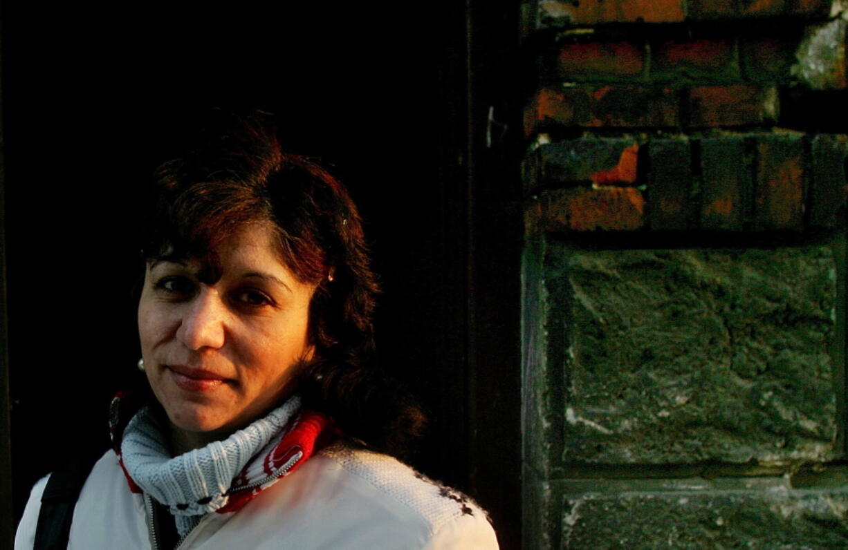 FILE - In this file photo dated Monday, Jan. 16, 2006, Elena Gorolova poses in Ostrava, Czech Republic. Dozens of roma women, including Gorolova were illegally sterilized in Sept. 1990, according to findings by the country's ombudsman.  The lower house of Czech Parliament on Friday June 4, 2021, has approved legislation to compensate Roma women sterilized against their will.