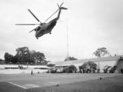 FILE - In this April 29, 1975, file photo the helicopter zone at the U.S. Embassy in Saigon, Vietnam, showing last minute evacuation of authorized personnel and civilians. With U.S. and NATO forces under a Sept. 11, 2021, deadline to leave Afghanistan, many are recalling that desperate, hasty exodus as they urge the Biden administration to evacuate thousands of Afghans who worked as interpreters or otherwise helped U.S. military operations there in the past two decades.