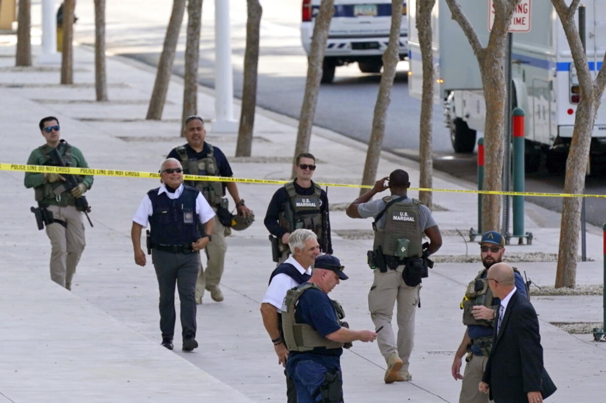 FILE - In this Sept. 15, 2020, file photo, federal law enforcement personnel patrol outside the Sandra Day O'Connor Federal Courthouse in Phoenix. The U.S. Marshals Service lacks the capability of adequately detecting threats against federal judges across the nation and uses outdated security equipment to protect judges' homes, the Justice Department's inspector general said Wednesday.  (AP Photo/Ross D.