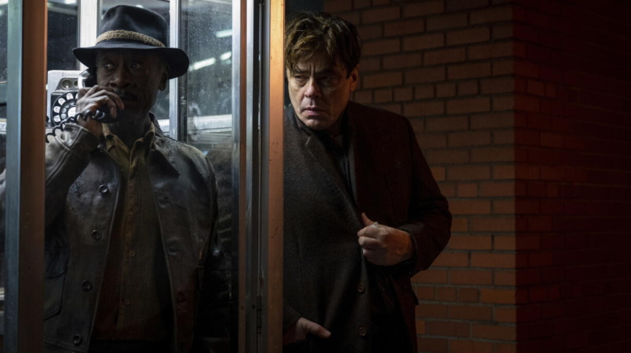 This image released by Warner Bros. Entertainment shows Don Cheadle, left, and Benicio Del Toro in a scene from "No Sudden Move." (Claudette Barius/Warner Bros. Entertainment via AP) (Claudette Barius/Warner Bros.