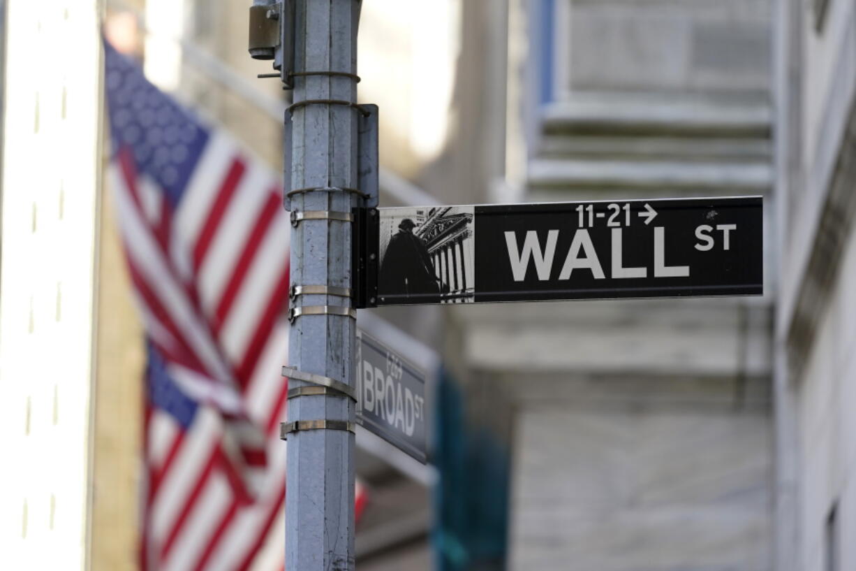 Flags adorn the facade of the New York Stock Exchange, Wednesday, June 16, 2021. Stocks are opening mostly lower on Wall Street Tuesday, June 22 as traders wait for more clues on the Federal Reserve's thinking on inflation.