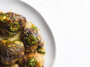 A recipe for glazed chicken thighs, seasoned with jalapenos and apricot preserves.