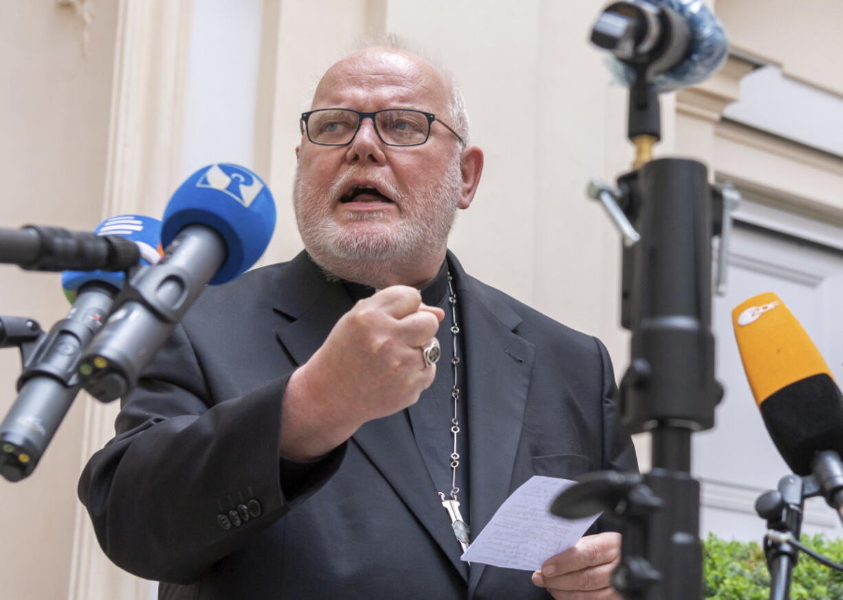 FILE - In this Germany, Friday, June 4, 2021 file photo, Cardinal Reinhard Marx, Archbishop of Munich and Freising, gives a statement to the press in the courtyard of his residence in Munich. Pope Francis refused Thursday, June 10, 2021 to accept the resignation offered by German Cardinal Reinhard Marx over the sex abuse scandal in the church, but said a process of reform was necessary and that every bishop must take responsibility for the "catastrophe" of the crisis.