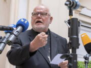 Cardinal Reinhard Marx, Archbishop of Munich and Freising, gives a statement to the press in the courtyard of his residence in Munich, Germany, Friday, June 4, 2021. A leading German cardinal and confidante of Pope Francis has offered to resign over the church's mishandling of clergy sexual abuse scandals and declared that the church had arrived at "a dead end." Cardinal Reinhard Marx published his resignation letter to the pope online Friday.