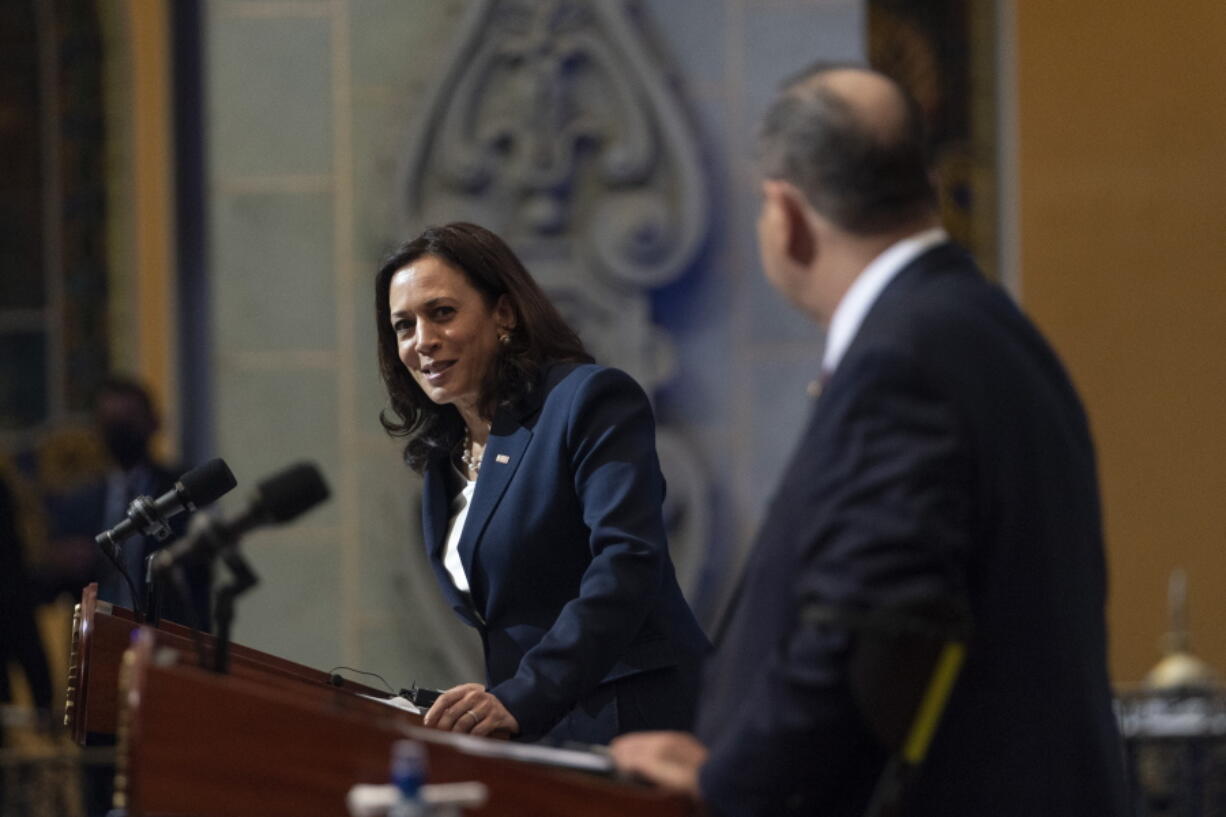 Vice President Kamala Harris, left, looks toward Guatemalan President Alejandro Giammattei, during a news conference, Monday, June 7, 2021, at the National Palace in Guatemala City.