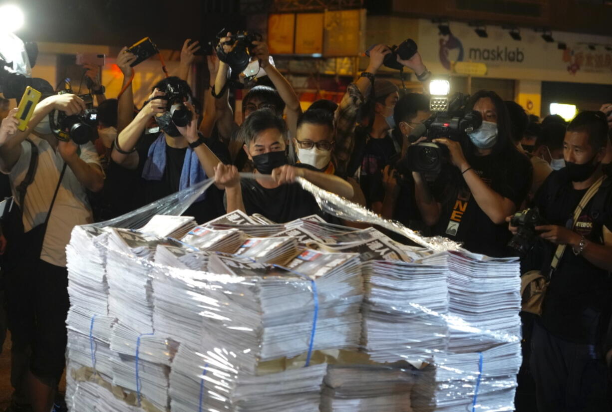 Last issue of Apple Daily arrive at a newspaper booth in Hong Kong, early Thursday, June 24, 2021. Hong Kong's pro-democracy Apple Daily newspaper will stop publishing Thursday, following last week's arrest of five editors and executives and the freezing of $2.3 million in assets under the city's year-old national security law.