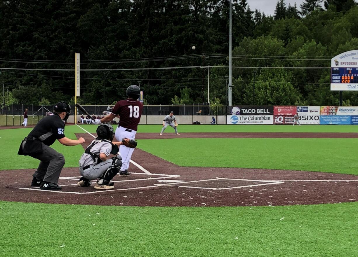 Ridgefield Raptors hitter Kody Darcy hits a grounder to third base during Sunday's game against Bend at the Ridgefield Outdoor Recreation Complex.