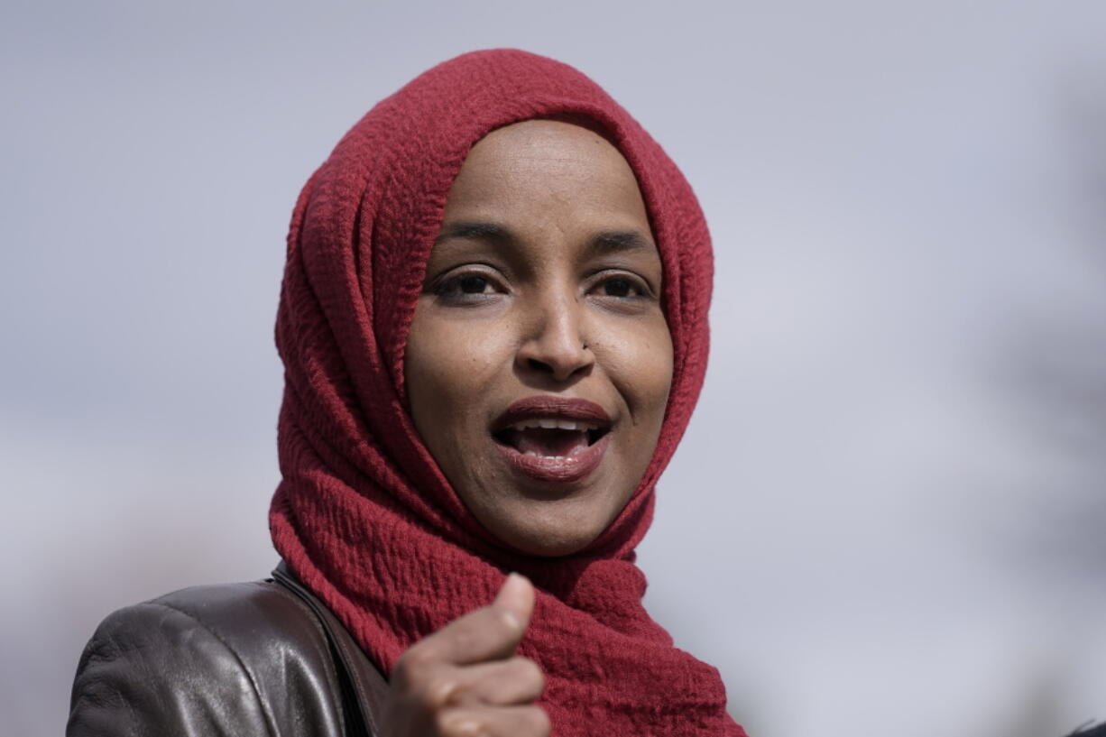 FILE - In this April 20, 2021, file photo Rep. Ilhan Omar, D-Minn., speaks in Brooklyn Center, Minn., during a news conference at the site of the fatal shooting of Daunte Wright by a police officer during a traffic stop. A group of Jewish House Democrats are accusin Omar of likening the U.S. and Israel to Hamas and the Taliban. The 12 Democrats say her comparison shows prejudice and gives "cover to terrorist groups." Their criticism comes after Omar asked Secretary of State Antony Blinken about atrocities she says have been committed by the U.S., Hamas, Israel, Afghanistan and the Taliban.