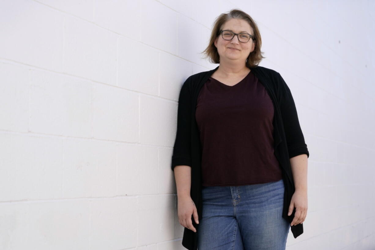 Elesha Gayman, Democratic chairwoman in Scott County, Iowa, stands outside her office, Wednesday, May 26, 2021, in Davenport, Iowa. Iowa's 2nd Congressional District race last year might have ignited a rally from Democrats whose six-vote loss was the narrowest for any U.S. House seat in almost 40 years.