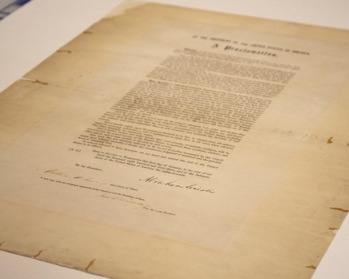 This updated handout photo provided by the Abraham Lincoln Presidential Library and Museum on Tuesday, June 8, 2021 shows a signed copy of Emancipation Proclamation. The Library, in Springfield, Ill., will mark Juneteenth, the holiday commemorating the end of slavery in the United States, by displaying the rare signed copy of the Emancipation Proclamation. The copy of the proclamation that's signed by Lincoln and Secretary of State William Seward will be displayed between June 15 and July 6. The original document is kept in the National Archives in Washington, D.C.