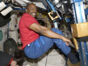 Astronaut Leland Melvin exercises Nov. 22, 2009, in the Unity module of the International Space Station while the space shuttle Atlantis is docked. Astronauts on the space station exercise two hours daily.