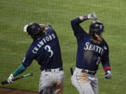 Seattle's Jake Fraley, right, celebrates his three-run home run with J.P. Crawford during the fourth inning.