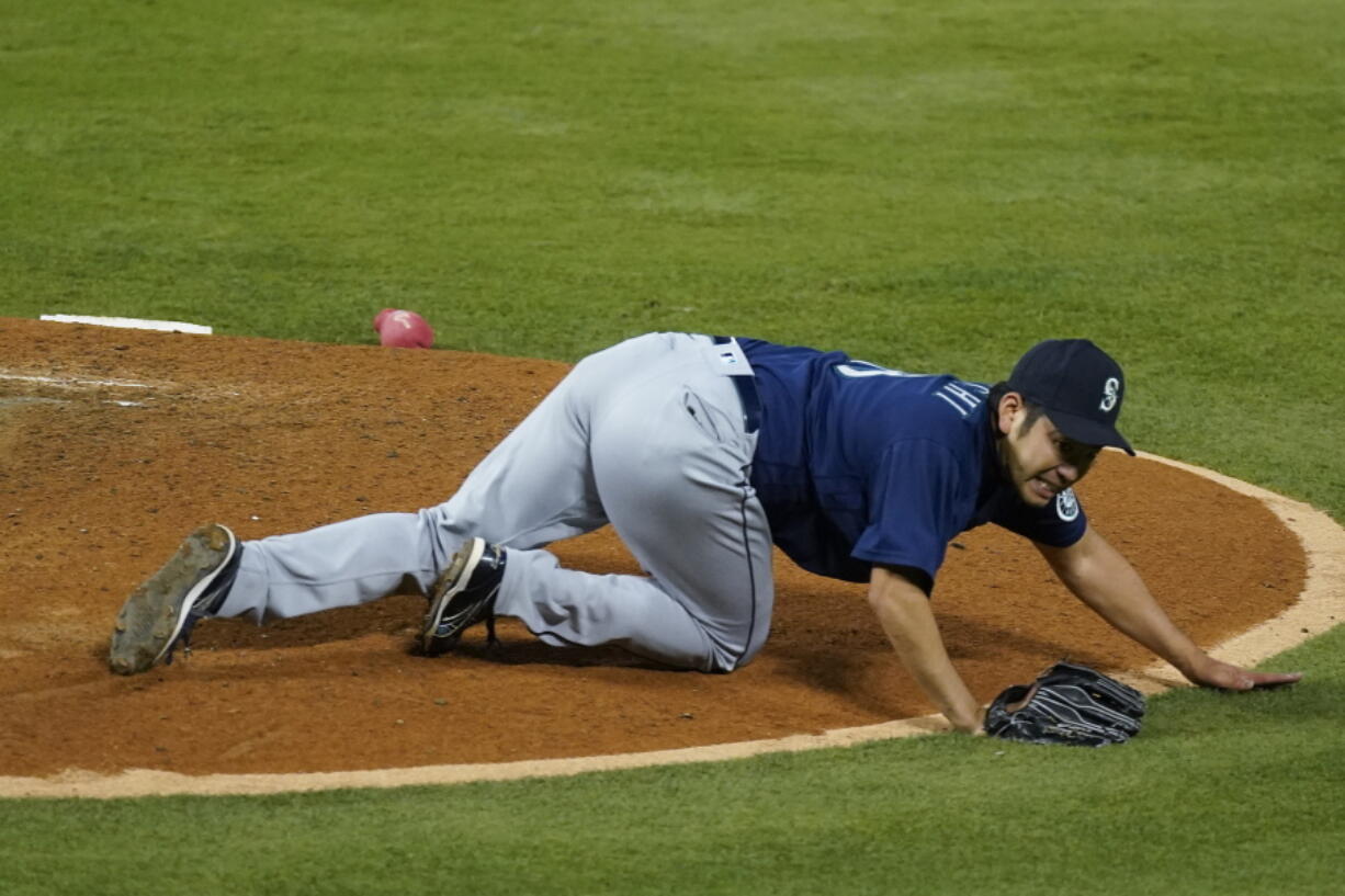 Seattle Mariners starting pitcher Yusei Kikuchi (18) reacts after being hit by a ball hit by Los Angeles Angels' David Fletcher during the fifth inning of a baseball game Saturday, June 5, 2021, in Anaheim, Calif.