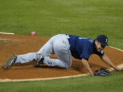 Seattle Mariners starting pitcher Yusei Kikuchi (18) reacts after being hit by a ball hit by Los Angeles Angels' David Fletcher during the fifth inning of a baseball game Saturday, June 5, 2021, in Anaheim, Calif.