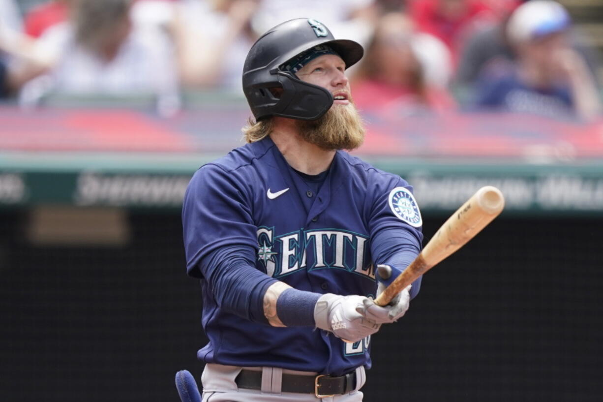 Seattle Mariners' Jake Fraley watches his ball after hitting a two-run home run in the fourth inning of a baseball game against the Cleveland Indians, Sunday, June 13, 2021, in Cleveland.