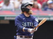 Seattle Mariners' Jake Fraley watches his ball after hitting a two-run home run in the fourth inning of a baseball game against the Cleveland Indians, Sunday, June 13, 2021, in Cleveland.