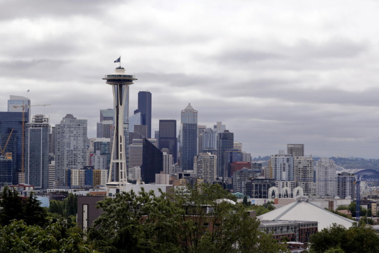 FILE - This July 23, 2020, file photo shows the view of the Space Needle, in Seattle. Record-high heat is forecast in the Pacific Northwest this weekend, raising concerns about wildfires and the health of people in a region where many don't have air conditioning. The National Weather Service has issued an Excessive Heat Watch and predicted "dangerously hot" conditions Friday, June 25, 2021, through at least Tuesday.