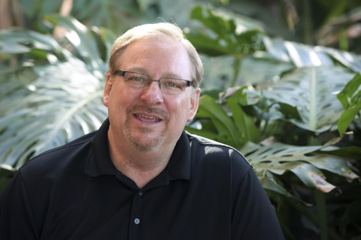 FILE - In this Monday, Feb. 24, 2014, file photo, Saddleback Church founder and Senior Pastor Rick Warren poses for a photo at the Saddleback Church in Lake Forest, Calif. Warren has announced his retirement after 42 years of leading Saddleback Church in Southern California. The Orange County Register reported Monday, June 7, 2021, that the 67-year-old Warren shared the news with his congregation on Sunday.