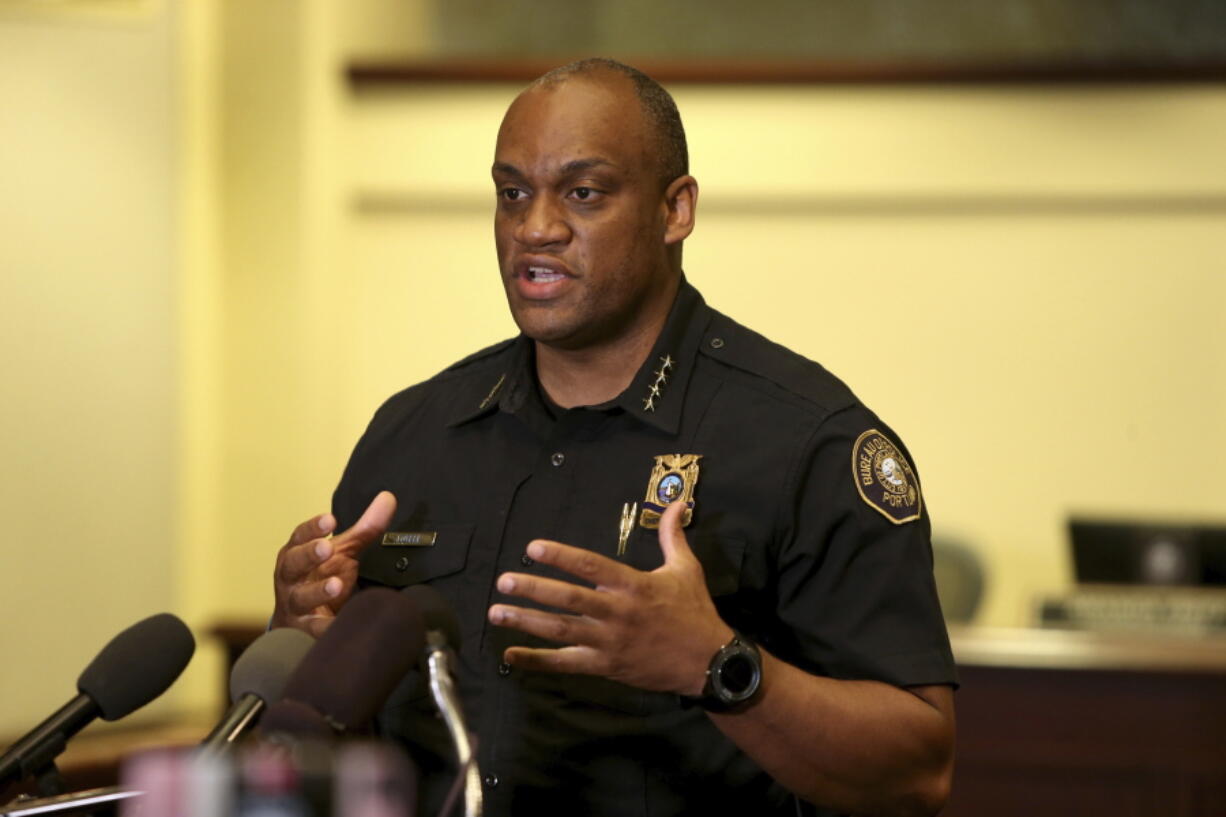 FILE - In this Aug. 30, 2020 file photo,  Portland Police Chief Chuck Lovell speaks during a news conference. On Tuesday, June 22, 2021, Lovell and Portland Mayor Ted Wheeler announced that officers will no longer pull over vehicles for low-level violations where public safety isn't a concern. Wheeler said the change was due in part to the fact that Black drivers are pulled over in disproportionate numbers in the city.