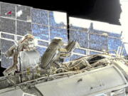 In this image taken from Roscosmos video, Russian cosmonauts Oleg Novitsky, left, and Pyotr Dubrov, members of the crew to the International Space Station (ISS), perform their first spacewalk on Wednesday, June 2, 2021, to replace old batteries outside the International Space Station. Two Russian members of the International Space Station crew are conducting a spacewalk. Oleg Novitskiy and Pyotr Dubrov are scheduled to conduct technical works before the arrival of a new Russian module. The duo is set to prepare for undocking and disposal of the Pirs docking compartment, which will be replaced later this year by the new Nauka (Science) multipurpose laboratory module.